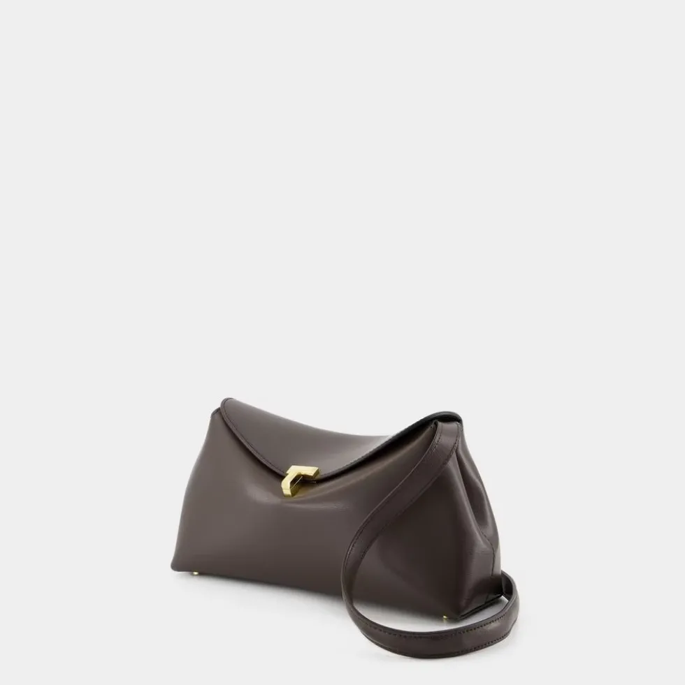 Brun læderclutch med aftagelig rem